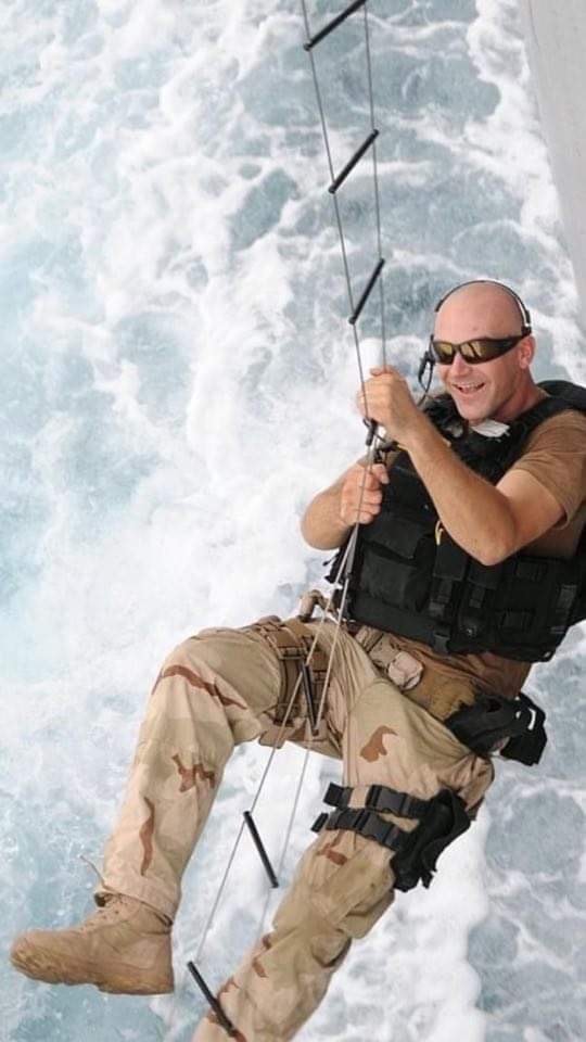 Justin Myers fast-roping from vessel during training