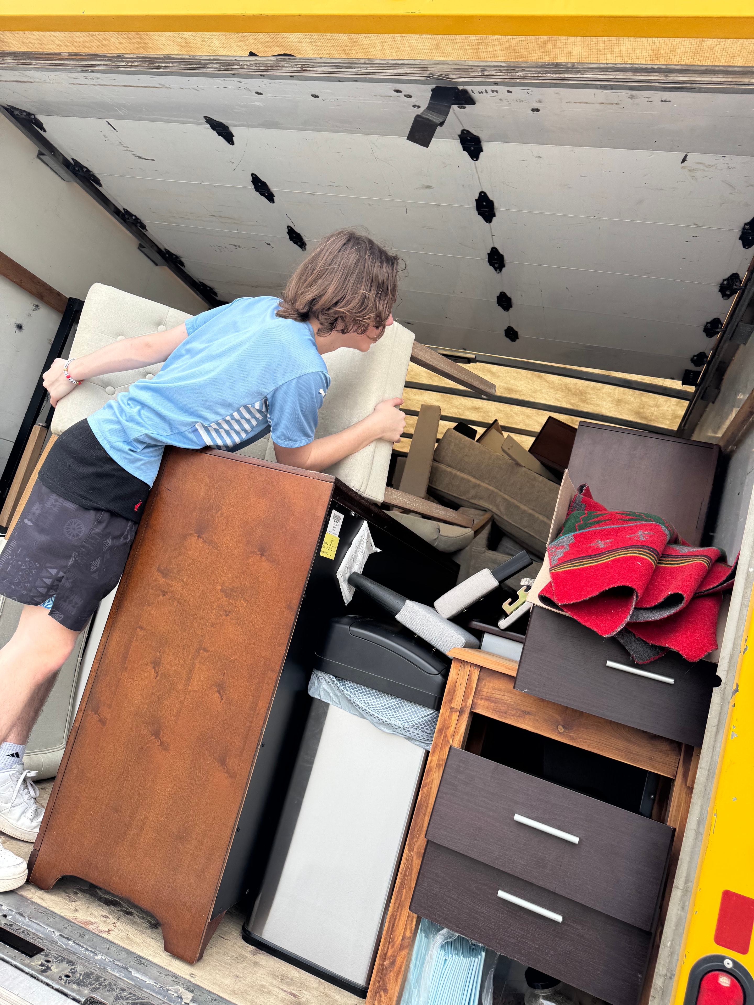 Professional movers handling furniture